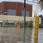 Flooding caused by 90,000 pounds of Mardi Gras Beads and cars blocking Drainage lines